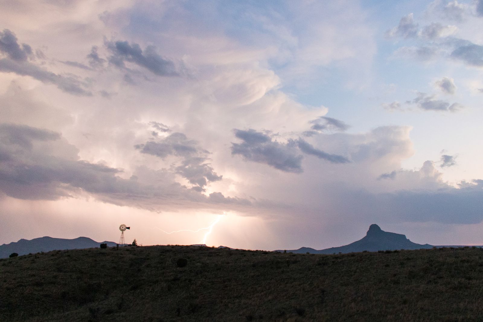 Wide clouds stacked over the Chisos at dusk