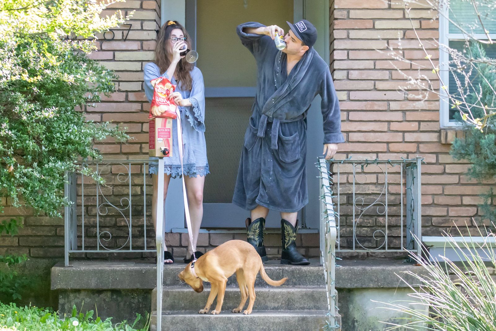Couple kissing on their front porch